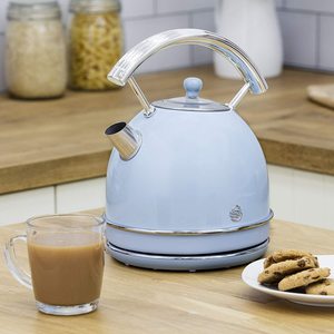 Swan Retro Dome Kettle on display in a kitchen.
